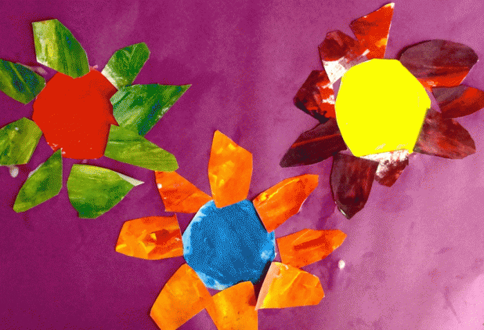 Colorwheel flowers spring art lesson using primary colored tempera paints